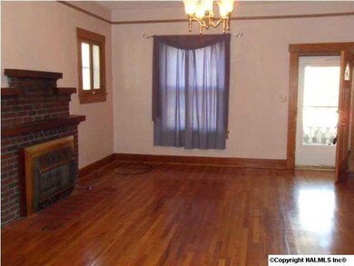 Living room with fireplace and hardwood floors