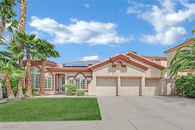 Mediterranean / spanish-style home with a garage,