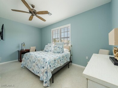 Tiled bedroom with ceiling fan