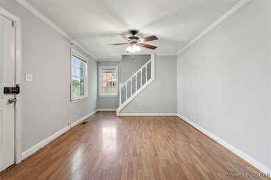 Empty room featuring light wood-type flooring, cro