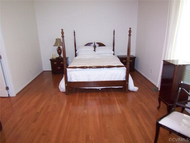 Master bedroom with hardwood floors