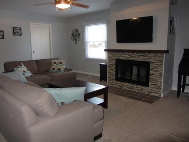 New carpet, paint & tile surround on fireplace.