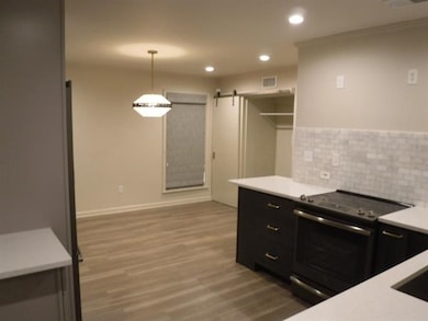 Kitchen featuring stainless steel electric stove, 
