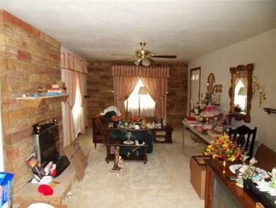 Living Room. Spacious LR beautiful stone wall & wo