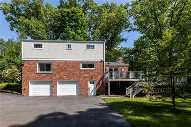Rear of house with large flat driveway