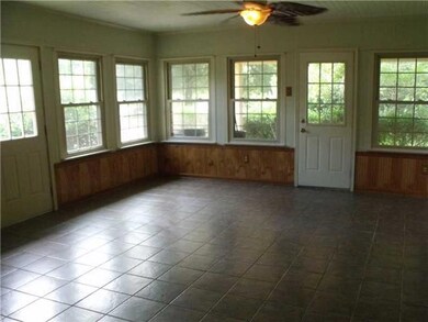 Sunroom. large bright open sunroom over looking re