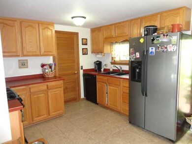 Kitchen. Nice oak cabinets, appliances included. D