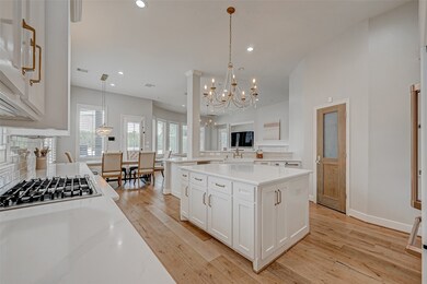 Spacious kitchen overlooks breakfast area and livi