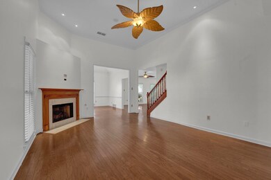 Unfurnished living room with hardwood / wood-style