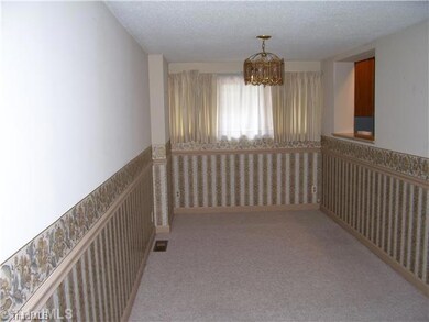Dining Room. Formal dining room has pass-thru to kitchen for convenience.