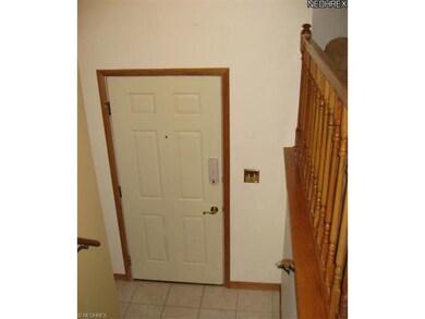 Enter into the tiled foyer and choose going up to 