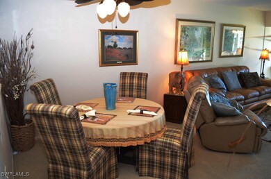Dining room featuring ceiling fan and carpet floor