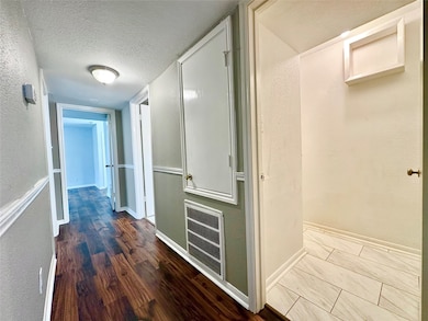 Hallway with walk-in utility room. New washer+drye