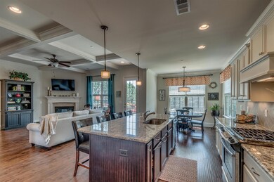 Open layout with great room, kitchen, and breakfast room.