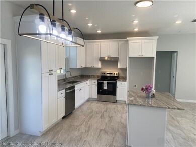 Dining Area to Kitchen, Crown Molding on Cabinets, Recessed Lights, Pantry, Designer Drop Dining Light