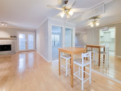 Dining area with ceiling fan.
