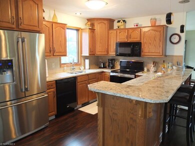 Gorgeous kitchen with granite countertops, tile ba