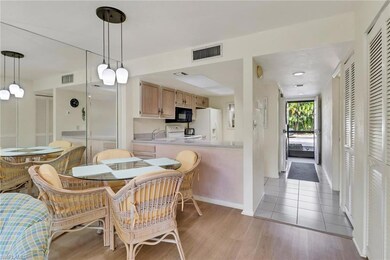 Dining area with visible vents and light wood-type