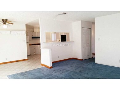 Property Photo. Living room looking into dinning a