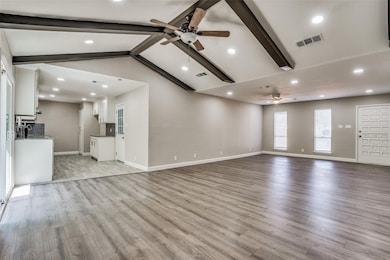 Unfurnished living room featuring ceiling fan, light wood-style flooring, and recessed lighting