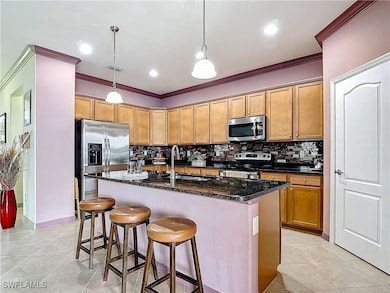 Kitchen with tasteful backsplash, visible vents, c