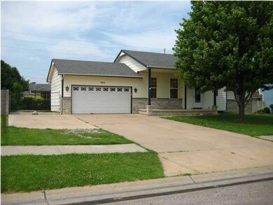 3rd car driveway (at left) leads through wrought i