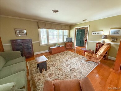 Living room featuring ornamental molding, visible