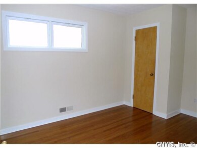 Bedroom. Walls have been recently painted and floo