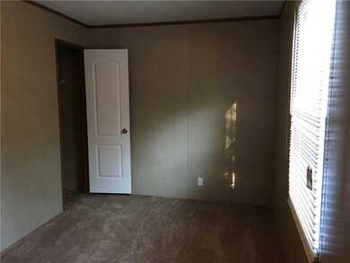 Empty room featuring carpet floors and ornamental