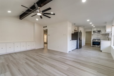 Unfurnished living room featuring light wood-style floors, recessed lighting, and a ceiling fan