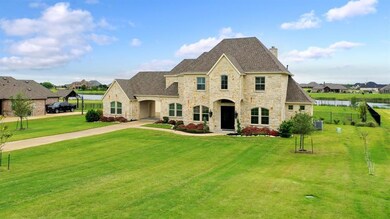 View of home with lake in the back ground.