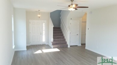 Family Room and Stairs - Different View