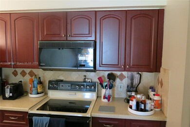 Kitchen with nice cabinets and microwave