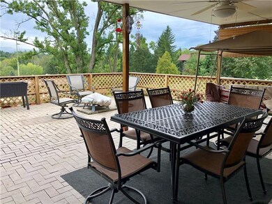 Tiled patio with a view of the Laural Mountains.
