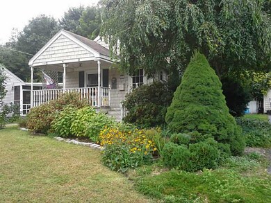 Exterior Front. Front porch with swing.