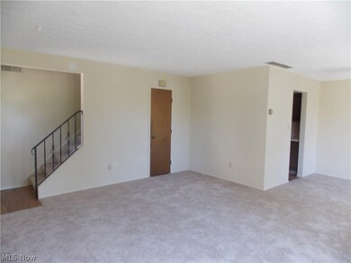 Open floor plan with living room and dining room.