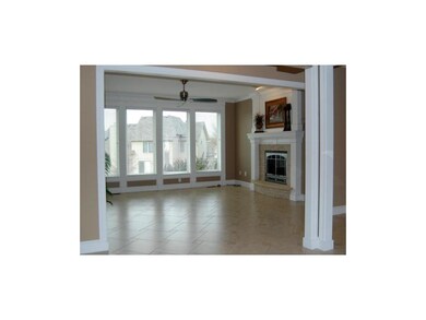 Family room with fireplace and tile floors
