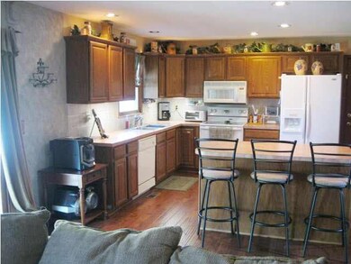 Great kitchen with lots of cabinets, island, and d
