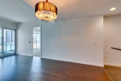 Empty room with dark wood-type flooring, baseboard