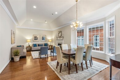Note tray ceiling with recessed lighting.