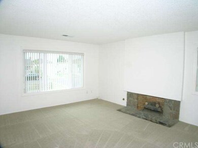 Large, front-facing living room with a picture win