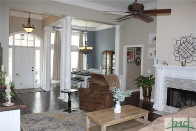 Volume ceilings, hardwood flooring, beautiful colu
