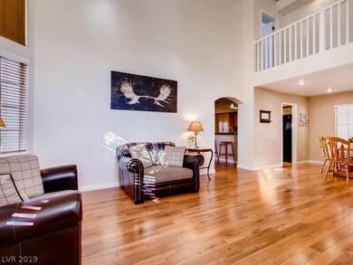 View from front door.  Living room with vaulted ce