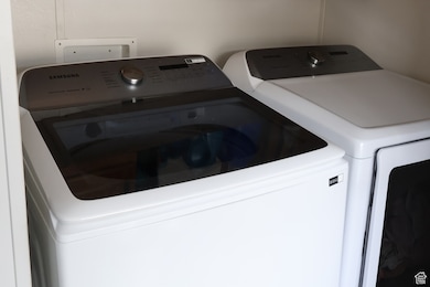 Laundry area with washer and clothes dryer