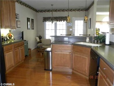 Kitchen - Corian countertops, wood floors and rece