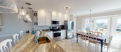DINING/KITCHEN WITH POOL&TENNIS COURT VIEW