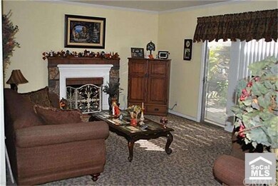 Living room with stone and brick fireplace