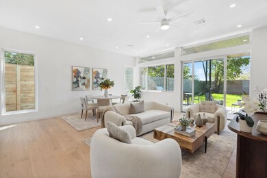 Living room featuring recessed lighting, light wo