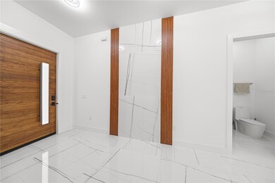 FRONT DOOR - FOYER ENTRANCE AND HALF BATHROOM