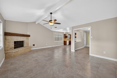 This entryway features a stylish white
door with an oval glass insert,
complemented by a side window for
natural light. The neutral walls and tile
flooring create a welcoming
atmosphere